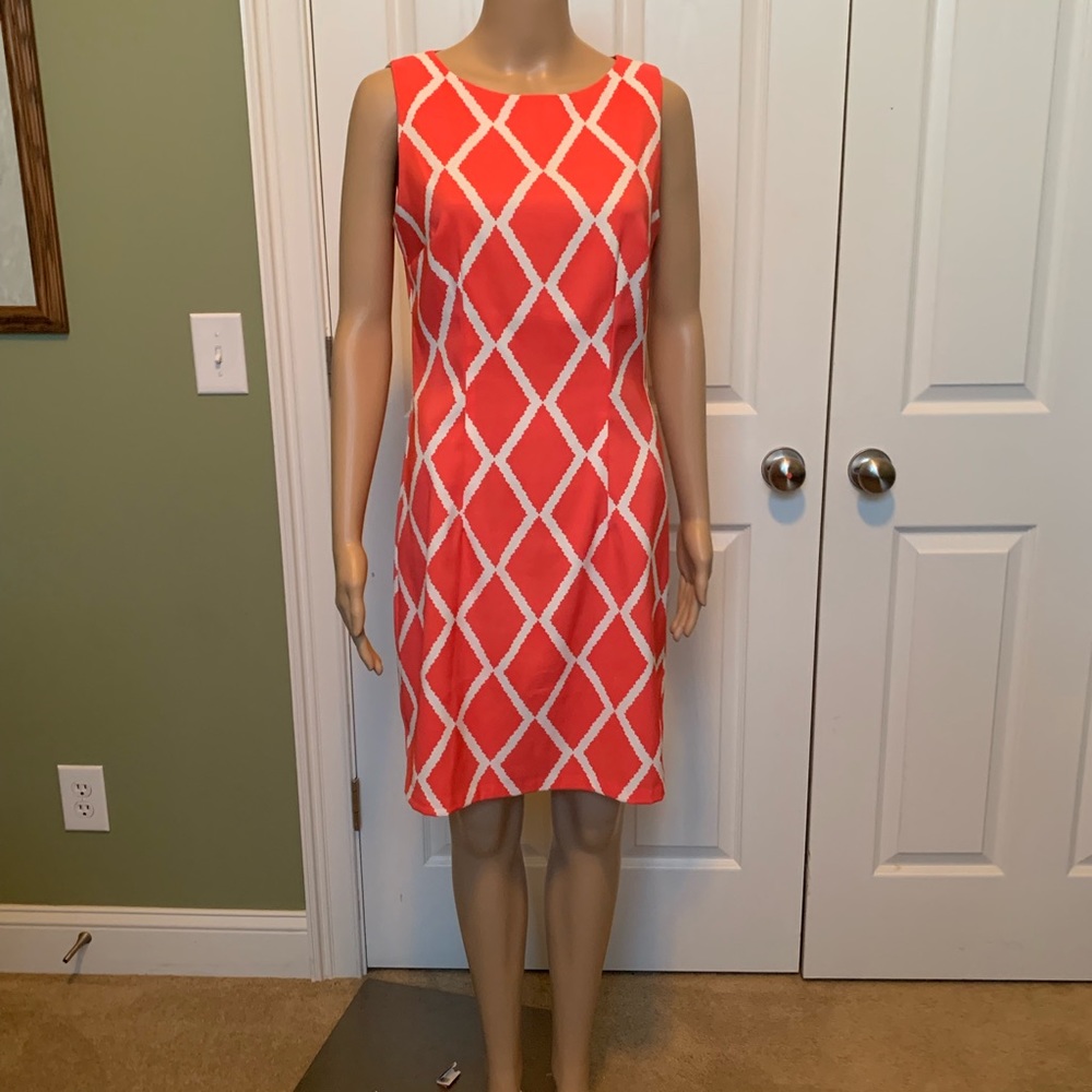 Orange and white patterned sleeveless dress.